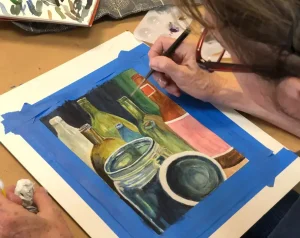 Adult student painting detailed bottles and jars with reflections during Art Class in Round Rock