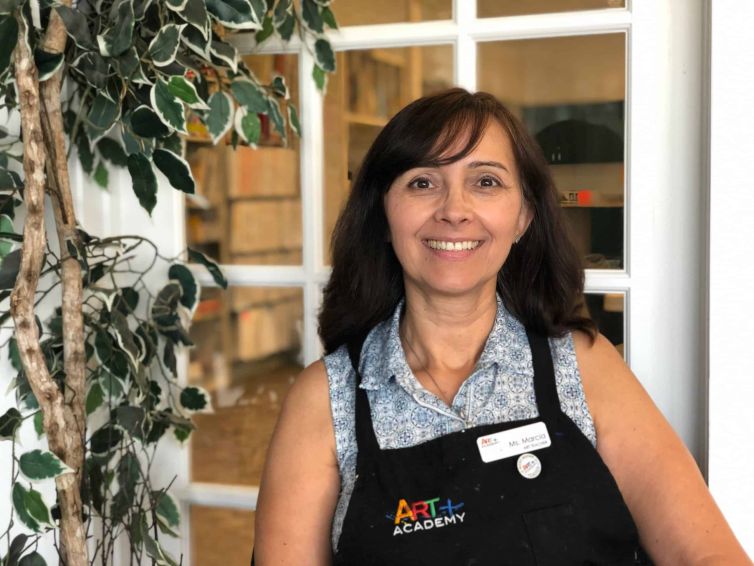 Portrait of an art teacher at Austin art school, highlighting professionalism and dedication to student learning