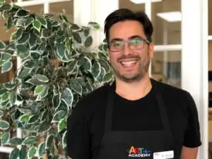 Portrait of an art teacher at Austin art school, highlighting professionalism and dedication to student learning