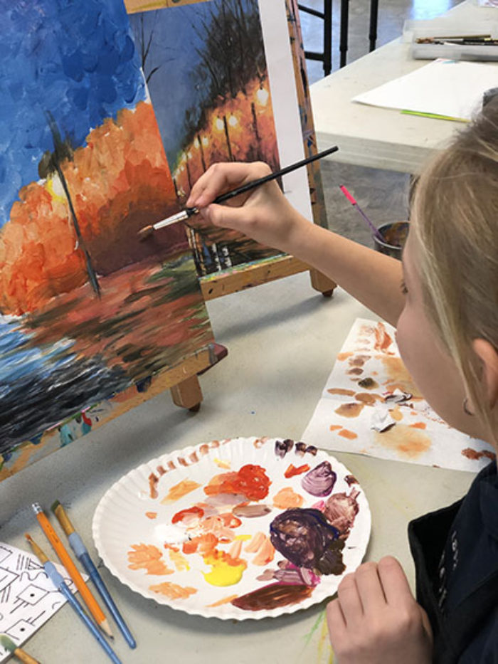 Learning to paint with acrylics in an art class for kids 7 to 9 years old at ART + Academy.