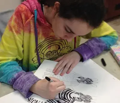 Learning how to draw in an summer art camp