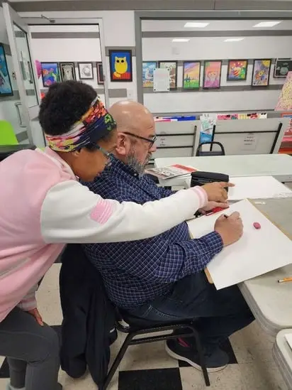 Cecely teaching how to draw