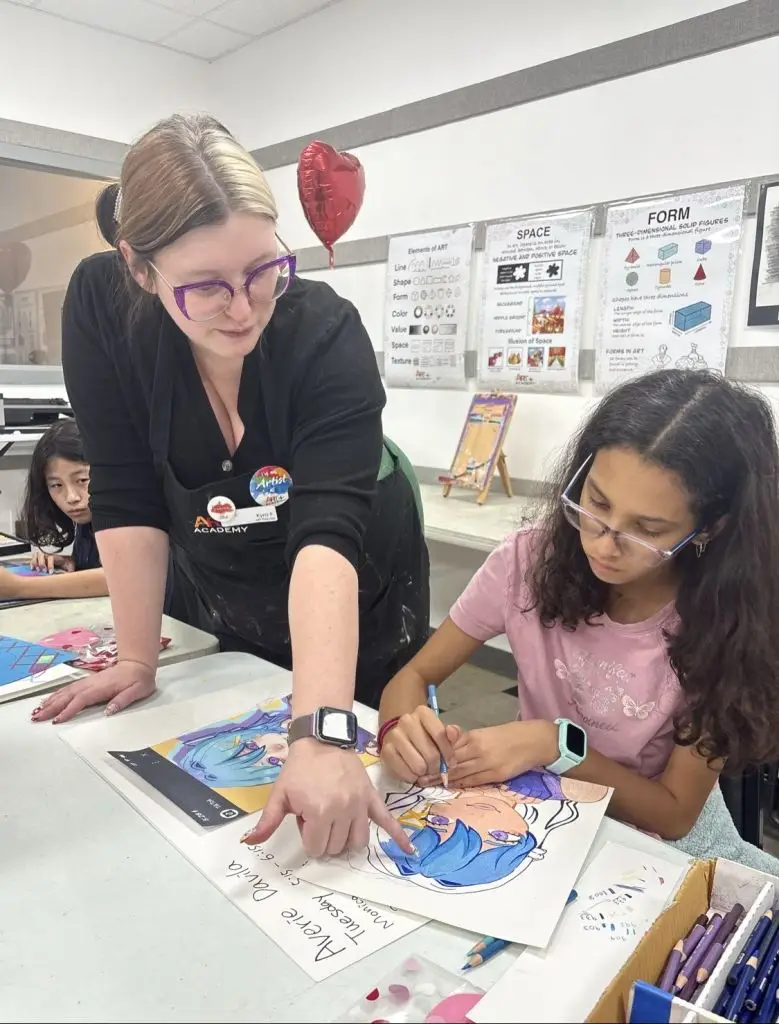 Ms. Kyra Art Teacher and student