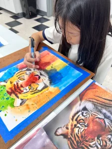 Colorful tiger artwork by child aged 9–12 created during Art Class in our NW-Austin studio near Brushy Creek, showcasing bold creativity and technique.